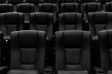 Fototapeta premium Empty black and white cinema seats in modern theater