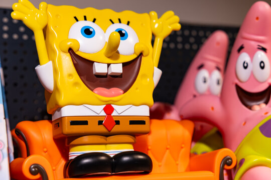 SpongeBob SquarePants and Patrick Star vinyl collectible figures on orange sofa