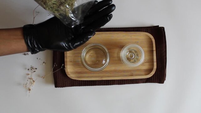 Pouring Rosemary Herbs for Hair Food Close-Up