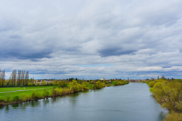 Naklejka premium Panoramic View of the Scenic Main River Flowing Through Lush Germany