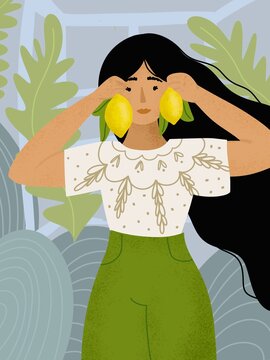 Woman holding lemons next to her ears creating natural fruit earrings in a green botanical setting
