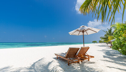 Captivating tropical beach resort sunny day palm trees beach chairs umbrellas crystal clear water luxury travel destination paradise vacation relaxation idyllic coastal scenery. Love couple honeymoon © icemanphotos