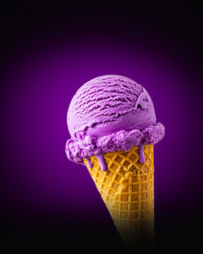 Fresh purple ube ice cream scoop on waffle cone tasty taro dessert blueberry flavor summer treat studio food photography