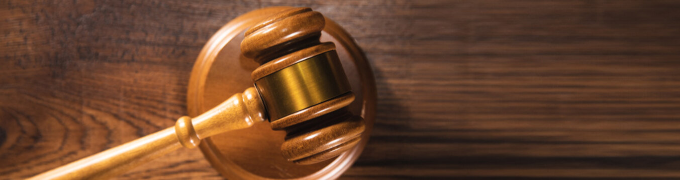 Judge gavel on grey table.