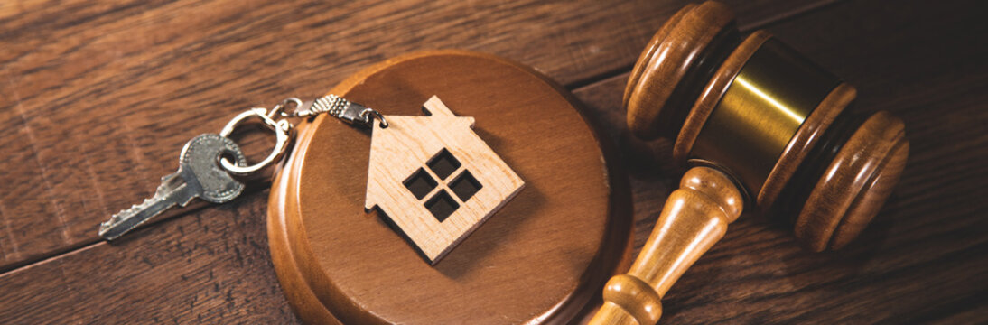 house key with judge and law book