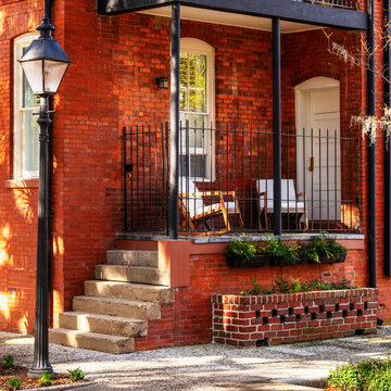 idyllic red brick house and porch in downtown Savannah