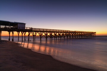 Fototapeta premium sunrise at Crystal Pier in Wrightsville Beach in North Carolina