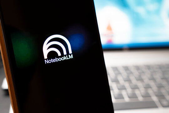 Warsaw, Poland - April 10, 2026: Close-up of NotebookLM logo displayed on a screen with blurred office background, representing technology and innovation in modern computing.
