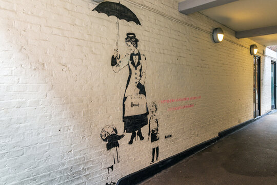 The mural of Princess Diana as Mary Poppins titled "Be As Naughty As You Want" by the British street artist Bambi at Neal's Yard in London.
