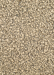 Beige rubber mulch texture background for playground or sports surface © Marcela
