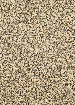 Beige rubber mulch texture background for playground or sports surface