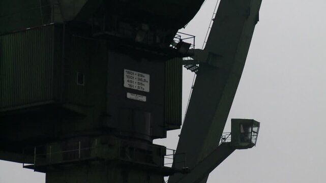 cranes on ship yard against sky
