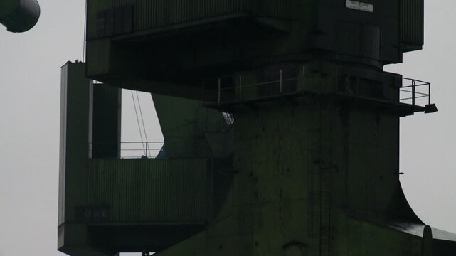 cranes on ship yard against sky