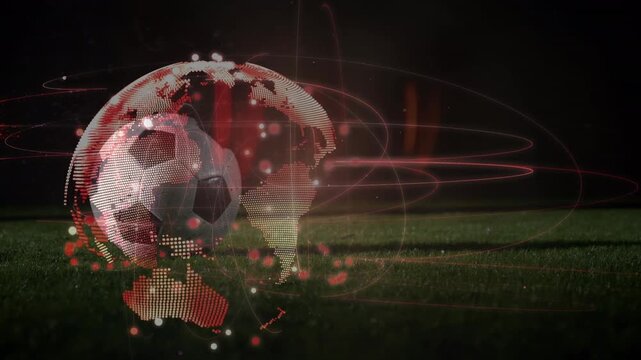 Animation of globe rotating over legs of male soccer player