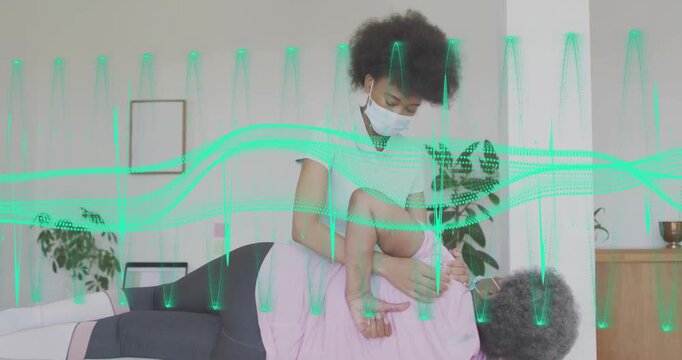 Chiropractor adjusting patient with green waveform overlay in clinic setting