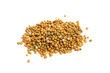 Fototapeta premium Controlled release fertilizer granules in various shades of yellow and green, piled on a white background, showcasing their round shape and distinct texture for agricultural use