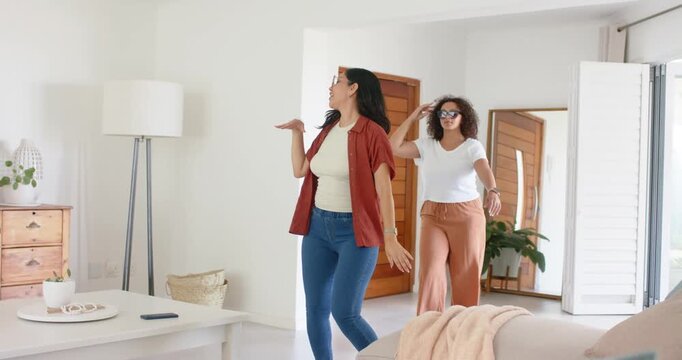 Door opening two women entering, lead spinning, mirroring, arrows syncing with sunglasses for home