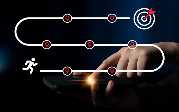 This image depicts a hand using a mobile device to navigate a conceptual path, emphasizing goal achievement and user interaction in a modern digital landscape. Ledger