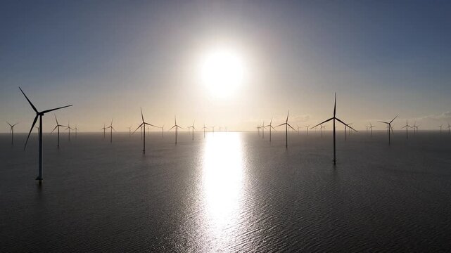 Wide offshore wind farm panorama from right to left