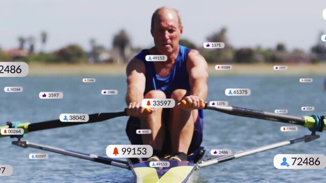 Senior rower extending and planting oars driving while sports badges showing metrics for training