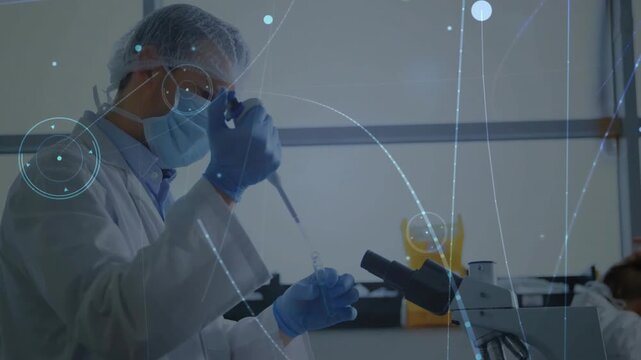Lab tech examining vial then pipetting sample with pipette at bench, animated HUD aiding analysis