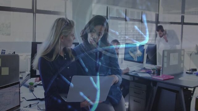 Two women reviewing case on laptop in business, tapping screen making blue ribbons forming EVIDENCE