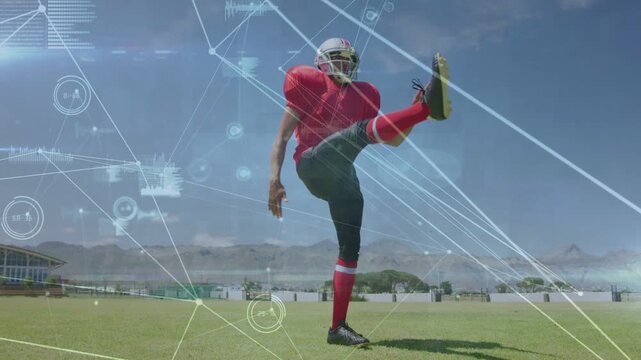 Football kicker releasing ball, kicking downfield while HUD data showing path for sports training