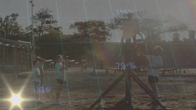 Child spotter reaching up and spotting climber on tripod peers rotating health glare grid shifting