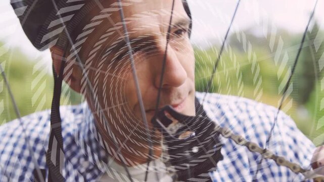 Cyclist feeling chain, tweaking through spokes, nudging derailleur to align under spiral overlay