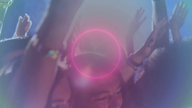 Concert crowd raising hands, neon ring appearing, expanding, pulsing, fans reacting to visuals