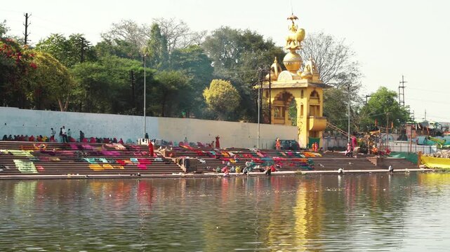 Ultra Wide Cinematic View of Shipra Ghat with Devotees and Riverfront Ujjain India