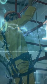 Vertical video: Plant worker clipping carabiner to scaffold per protocol, testing amid code overlay