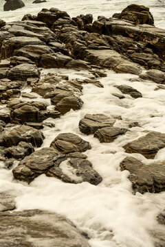 Rocky coastline at Punta Carnero Algeciras Cadiz with crashing waves