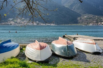 Traditional Rowing Boats on Shore of Kotor Bay Montenegro © Liana