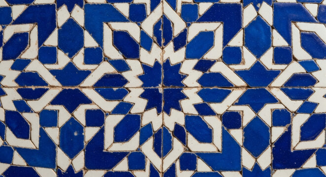 Close-up of traditional Moroccan zellige tilework with cobalt blue and white geometric star pattern