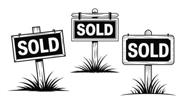Set of wooden sold real estate signs with grass