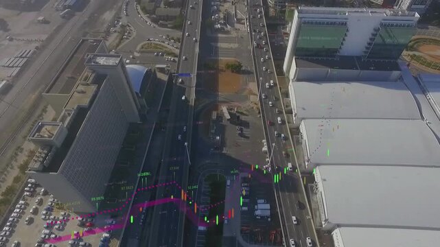 Animation of financial data processing against aerial view of cityscape