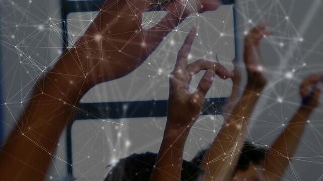 Participants responding to off-frame cue, raising arms, forming OK gesture, tech overlay over hands