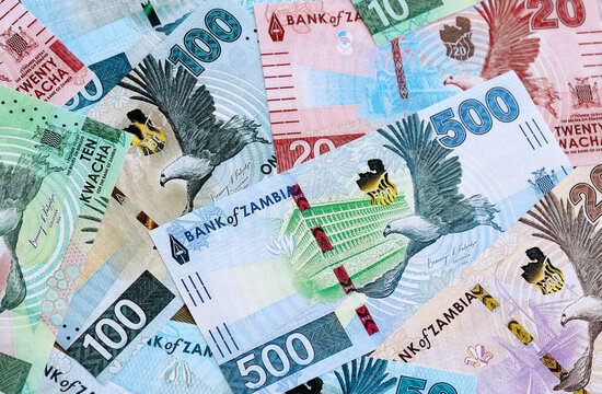 Zambian kwacha money banknotes pile on table. Zambia bills of ZMW currency close up