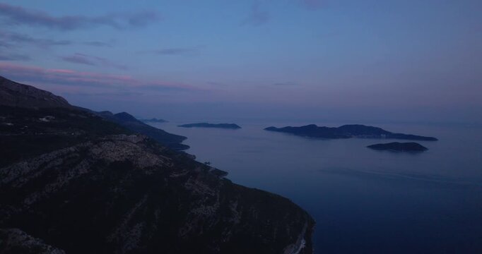 Coastal Islands Aerial At Dusk With Pastel Sky And Calm Sea, Distant Archipelago And Sweeping Shoreline Cliffs, Cinematic Drone Glide Capturing Tranquil Evening Mood,
