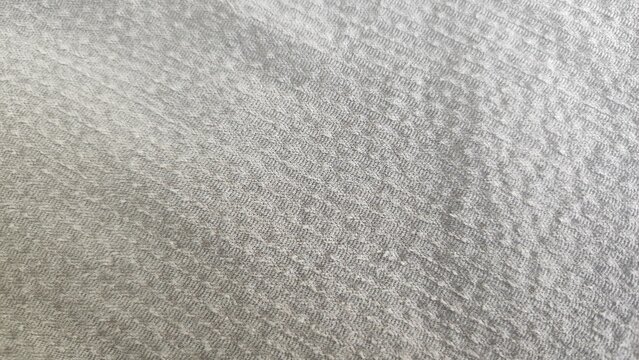 Texture of the Wrong Side of Gray Corduroy Fabric Laid Diagonally