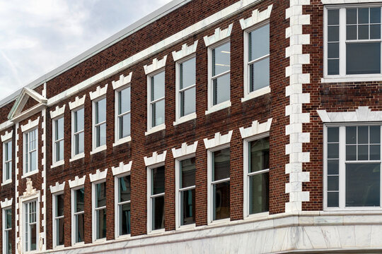Historic red brick building with elegant white stone accents in Cambridge, Massachusetts
