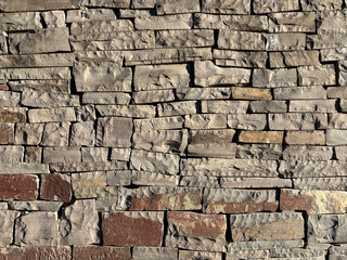 Obraz premium Natural stacked stone wall texture, rustic rock background with detailed surface