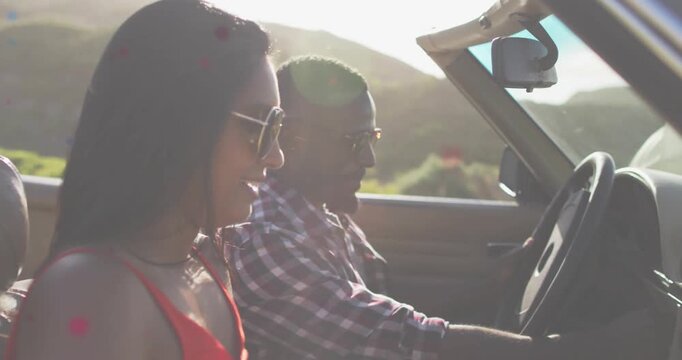 Vertical video: Driver using map then folding, steering while woman smiling, navigating for car ad
