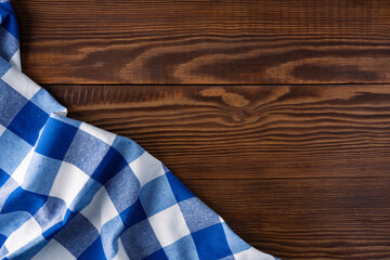Obraz premium Blue tablecloth on wooden background