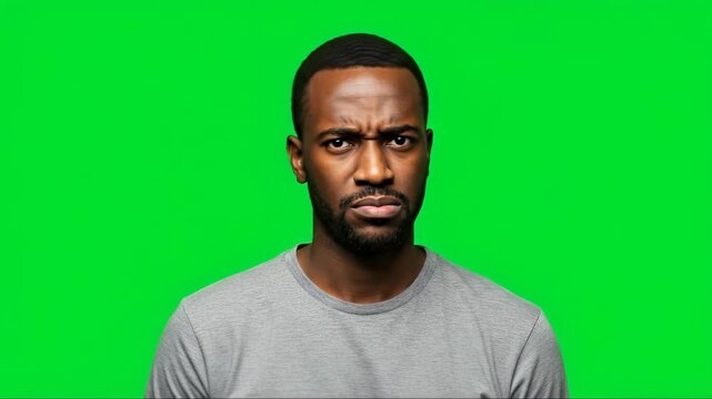 Man with Angry Expression on Green Screen Background.