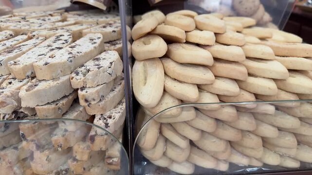 Stacks of traditional French biscotti cookies in glass display case
