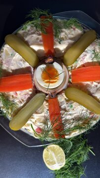 Classic Olivier Ruska Salad with Egg, Mayo, Carrots and Dill in a Glass Bowl