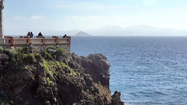 Footage of Piazza Bovio outstretched in the Mediterranean sea with its picturesque lighthouse, in Piombino city center, Province of Livorno Tuscany, Italy