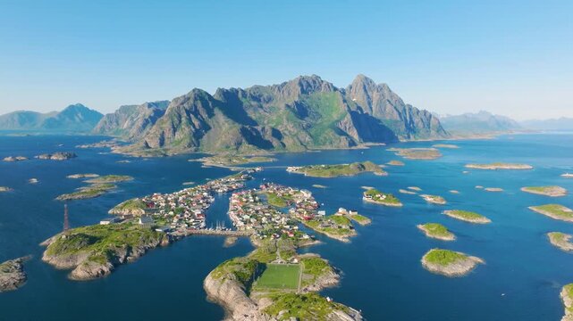 Aerial drone view of Henningsvaer village in Lofoten islands, Norway. Scenic summer video with mountains, islands and ocean. A famous place. Travel and vacation in Scandinavia.